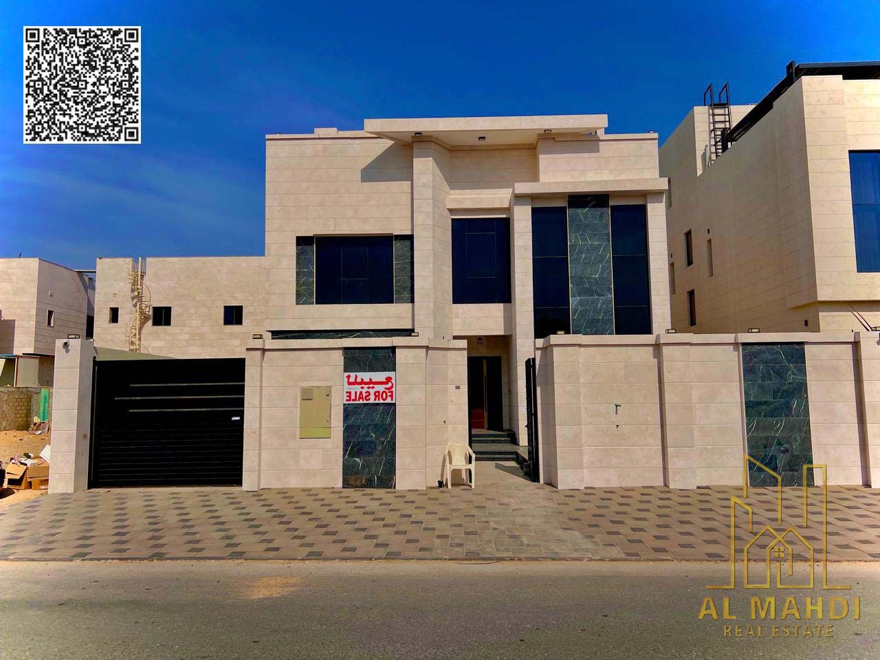 For sale, a luxury villa in a prime location in Al Alia Area Ajman, directly facing a main paved road and with direct access to Sheikh Mohammed Bin Za