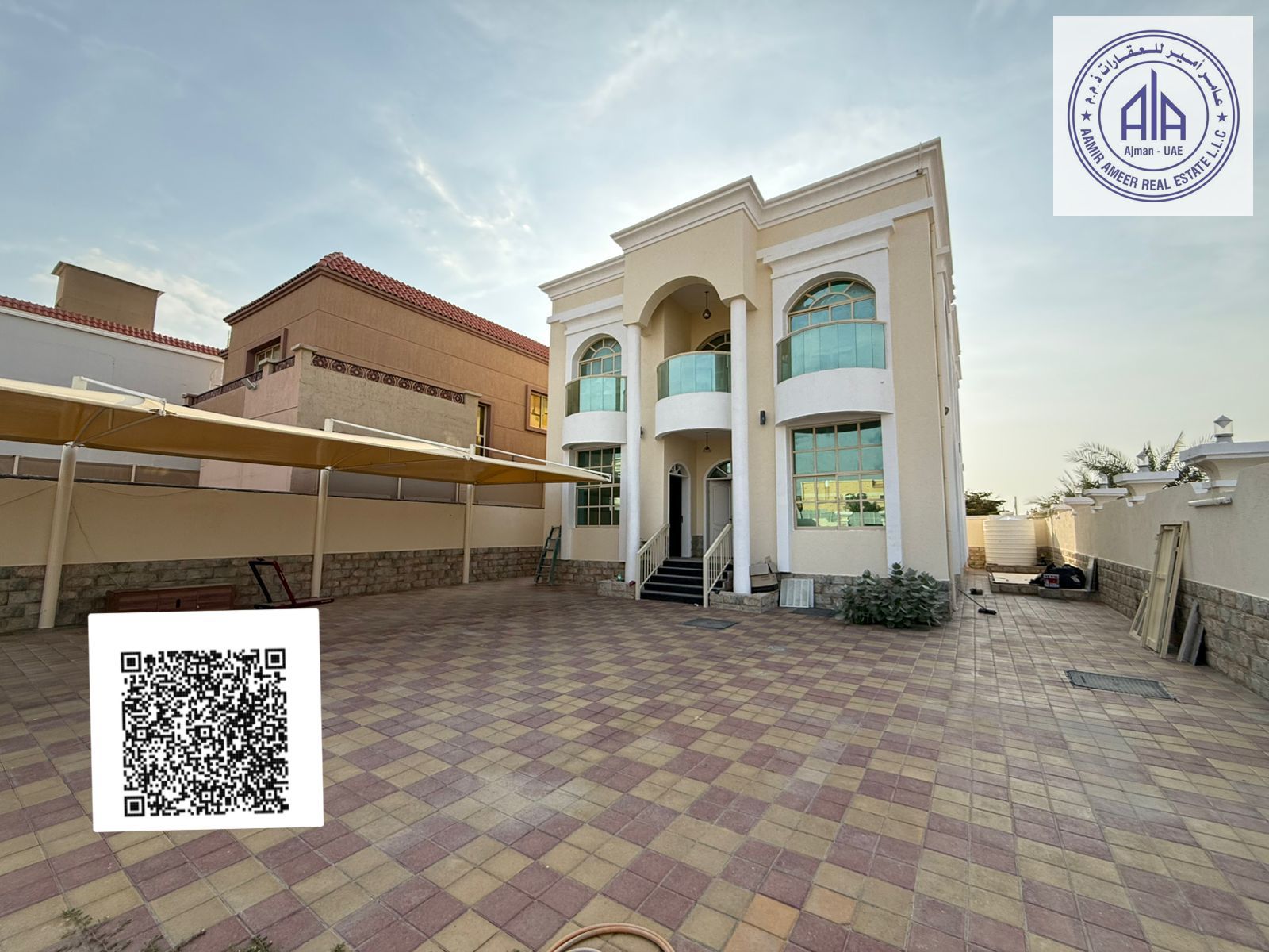 Residential and commercial villa for sale on a corner in Al Muweihat 1