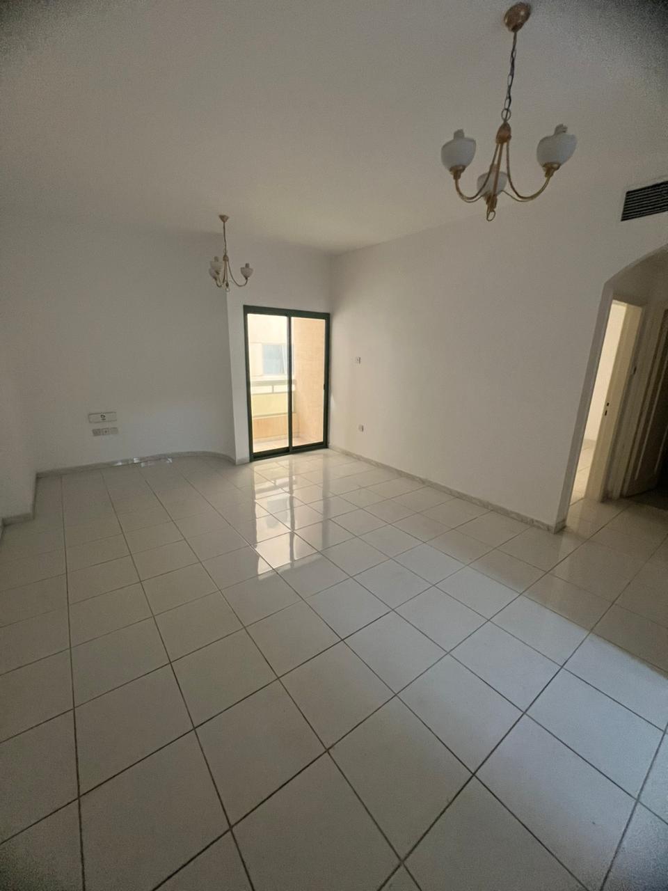 One-bedroom apartment with balcony in Al Majaz 3, free AC, one bathroom and extra parking, annual rent AED 37,000 with flexible payment options.