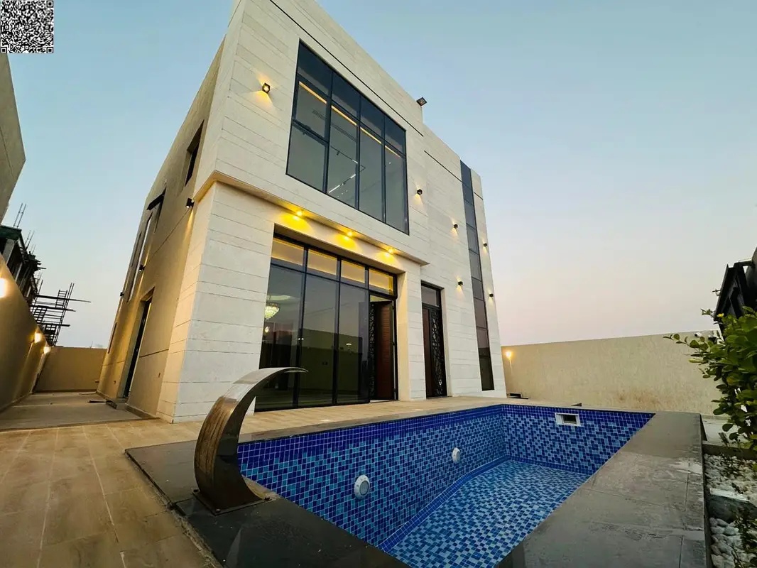 Luxury villa for sale in Ajman with a private pool and spacious garden, featuring a luxurious design and distinctive finishes, directly from the owner
