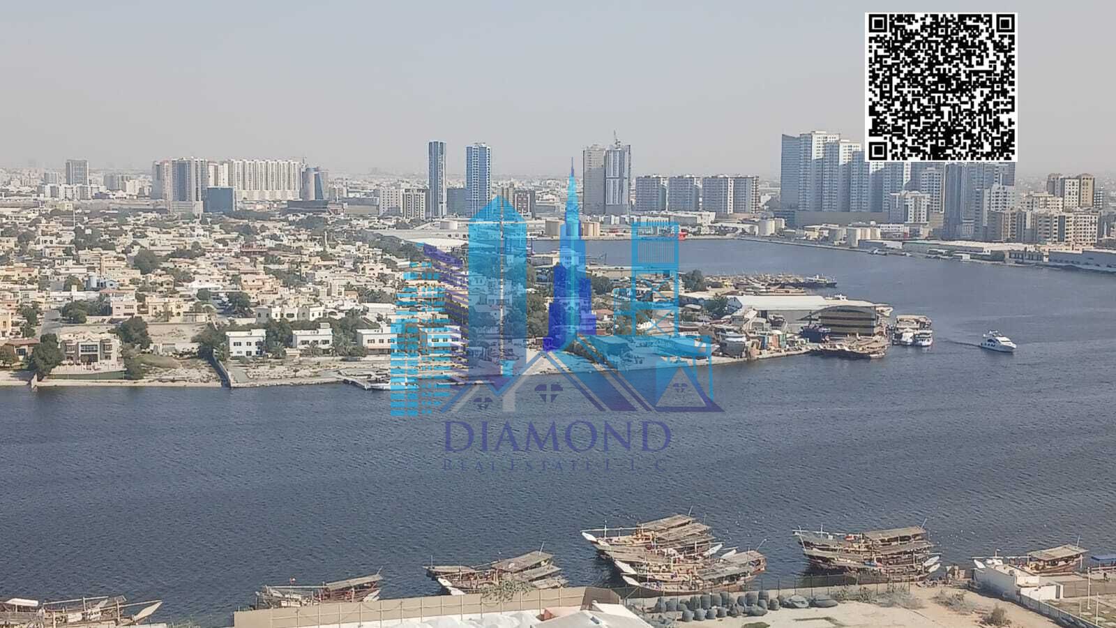 For sale: a vacant one-bedroom apartment with a view of Ajman Creek in the Orient Towers, freehold ownership in the Emirate of Ajman.