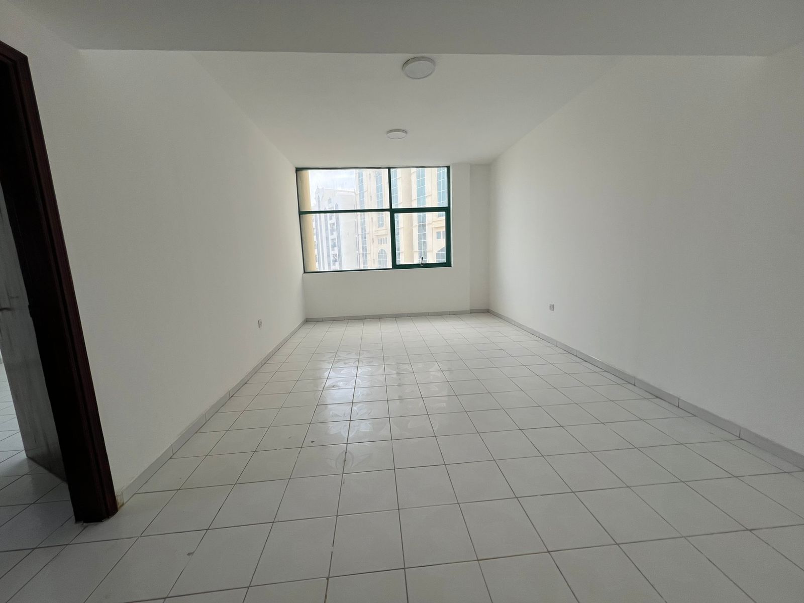 Balcony with open view, spacious layout, central AC, flexible payment options, family residence.