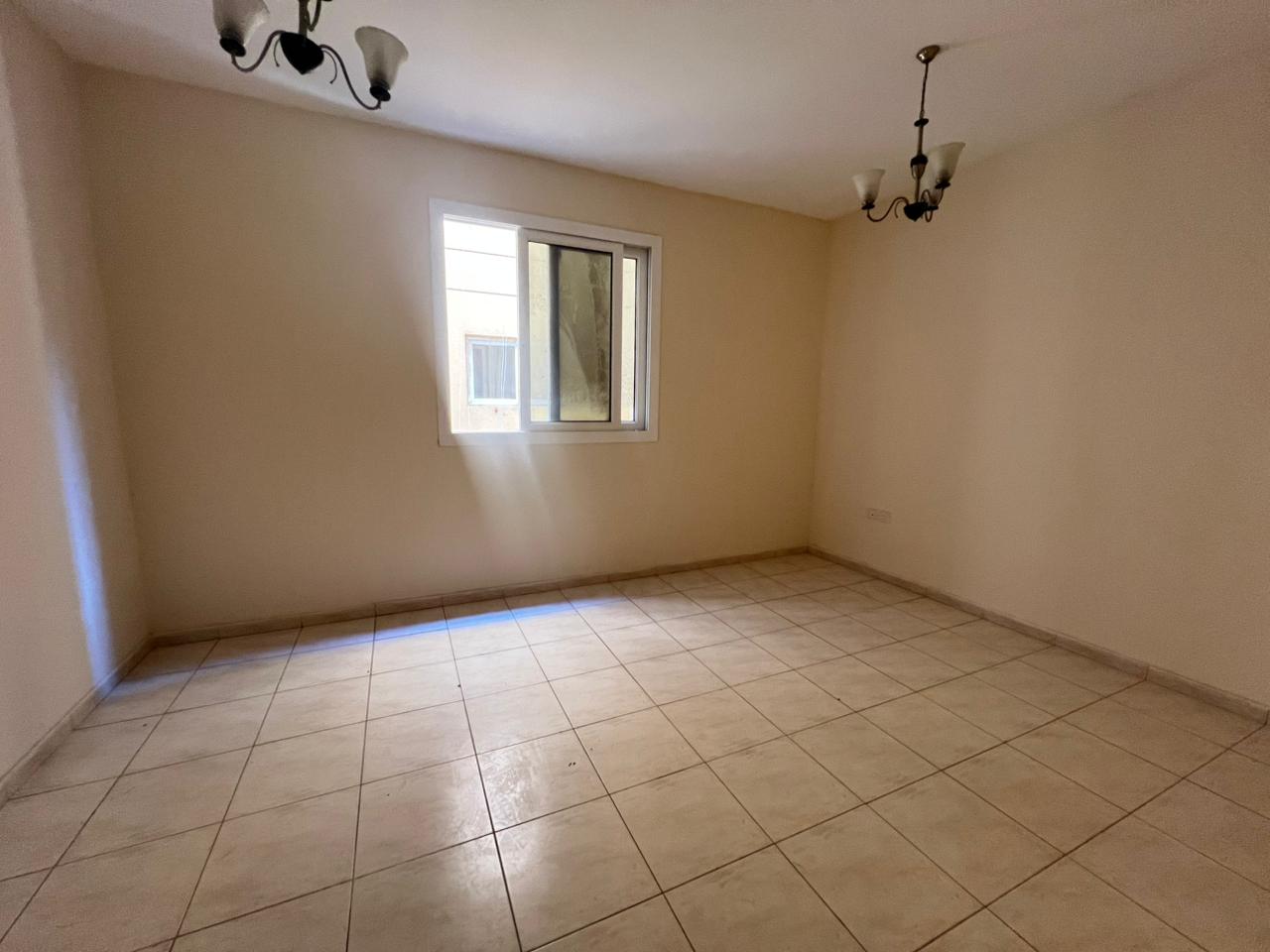 Two-bedroom apartment with living room for annual rent in Al Majrah, prime location near services, payable in 4 or 6 installments, suitable for famili