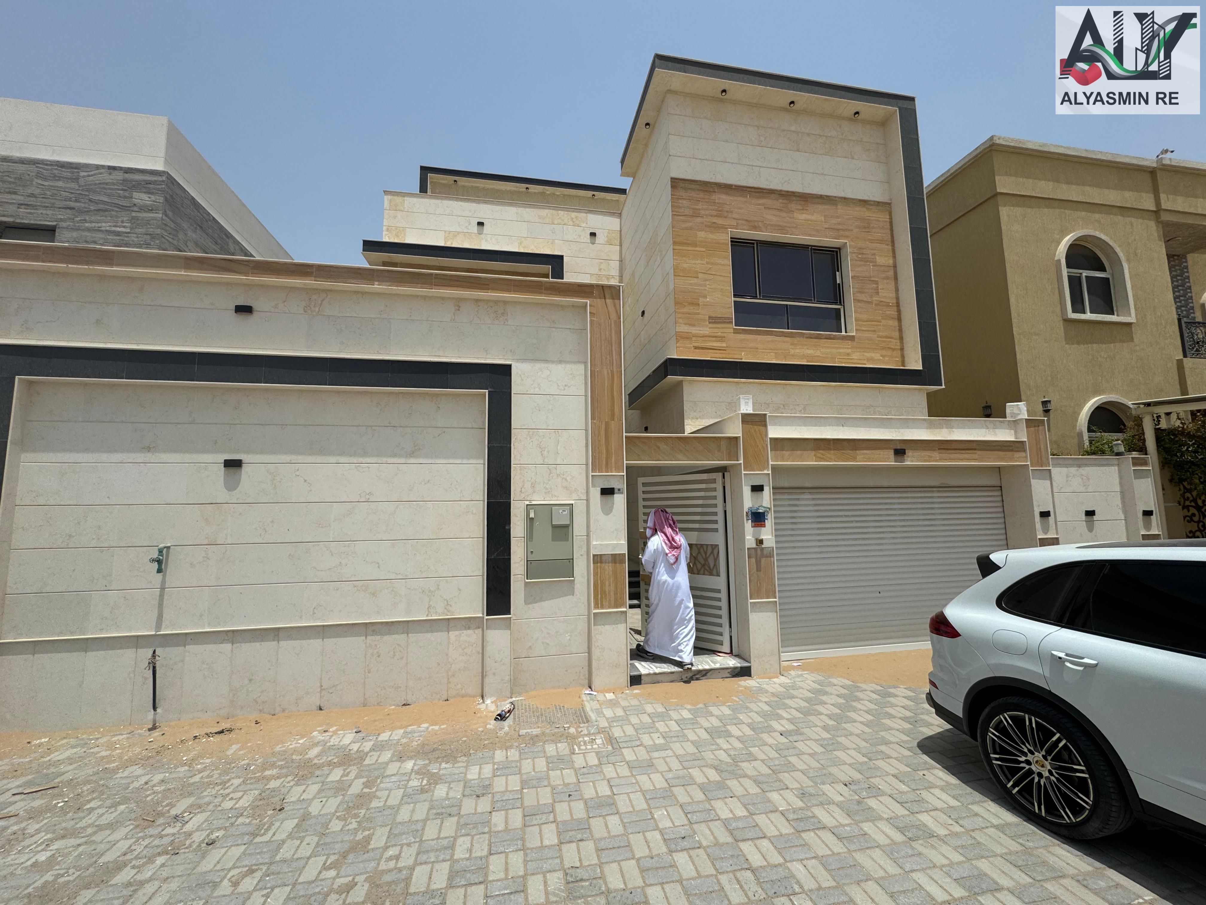 Luxury villa for sale in Al Yasmeen area - Ajman, prime location on a main street. Price includes electricity and water connection