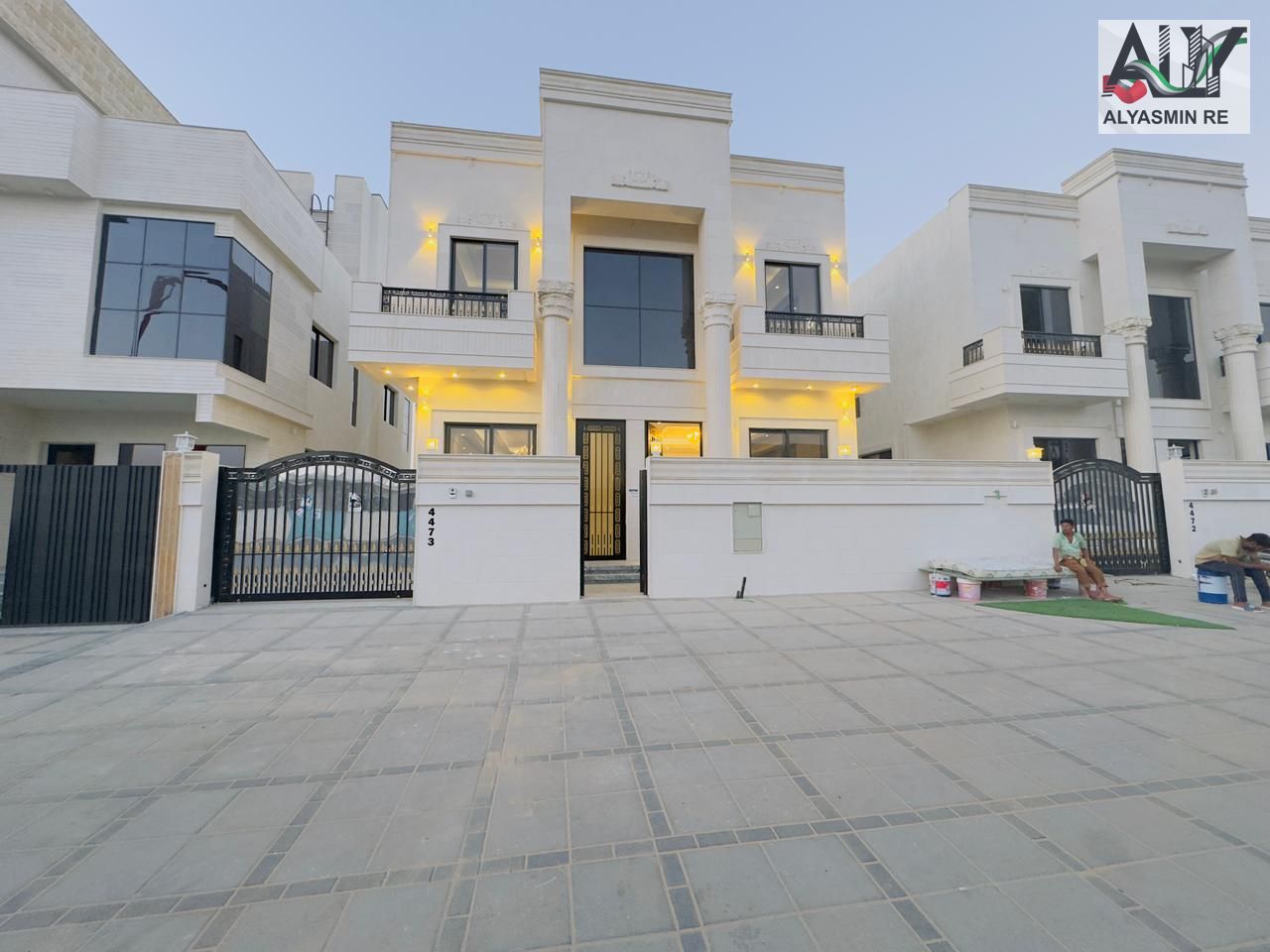 Luxury classic villa for sale in Al Helio area - Ajman, including registration fees, ownership, and electricity and water connections.