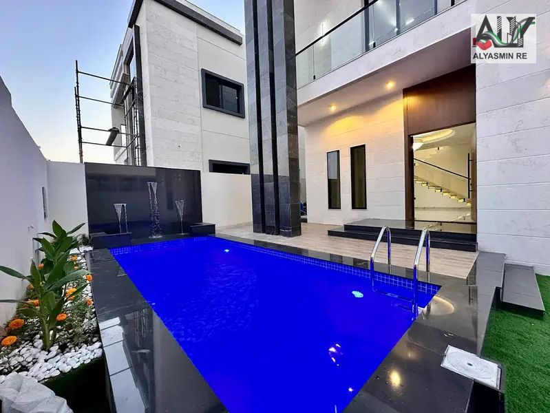 For sale, a luxurious villa in a very distinguished location, very close to Sheikh Mohammed bin Zayed Road, including registration and ownership fees