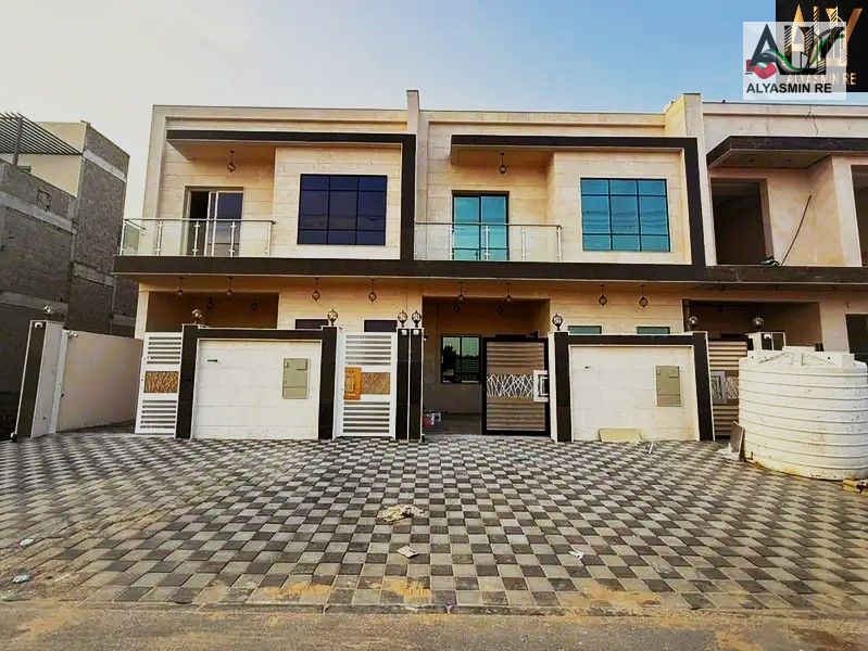 Own a villa at the lowest price in Ajman (ground floor + first floor + roof) including registration and ownership fees, one minute from Sheikh Mohamme