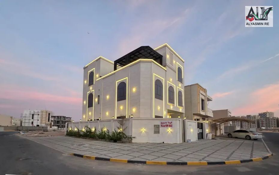 Luxury modern corner villa with a stone facade, 7 bedrooms (ground floor, first floor, and roof), located in Al Amerah area, Ajman. Registration fees