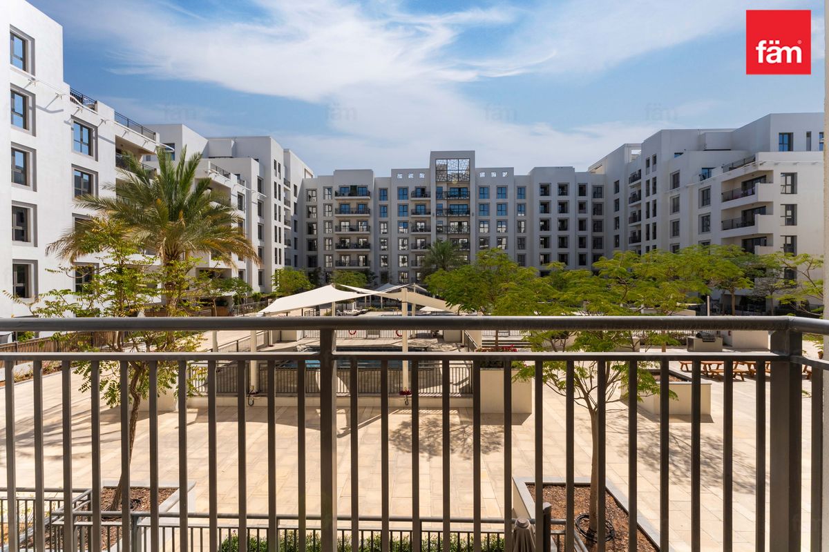 Balcony overlooking sparkling pool Bright & Airy