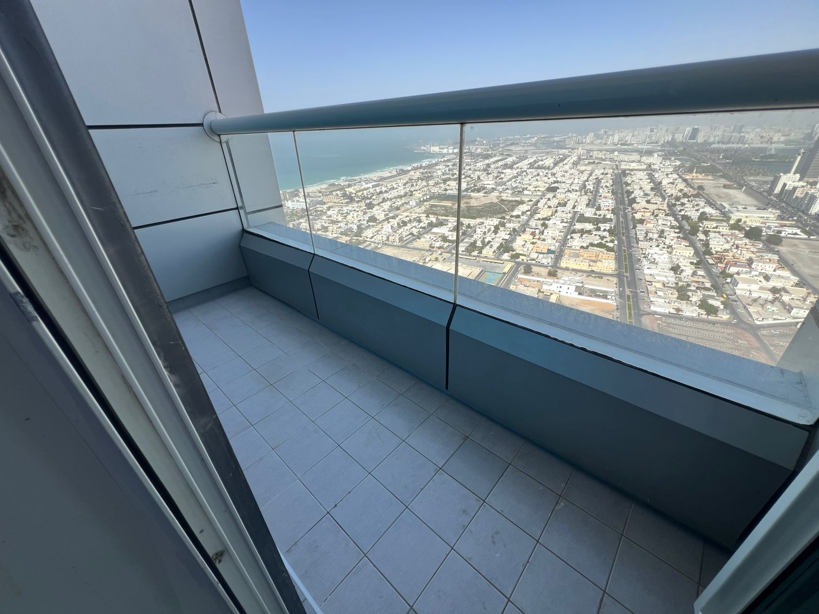 Four-bedroom apartment with living room in Al Khan, 2 balconies, master maid’s room, 4 bathrooms, open views, and built-in wardrobes, luxurious design