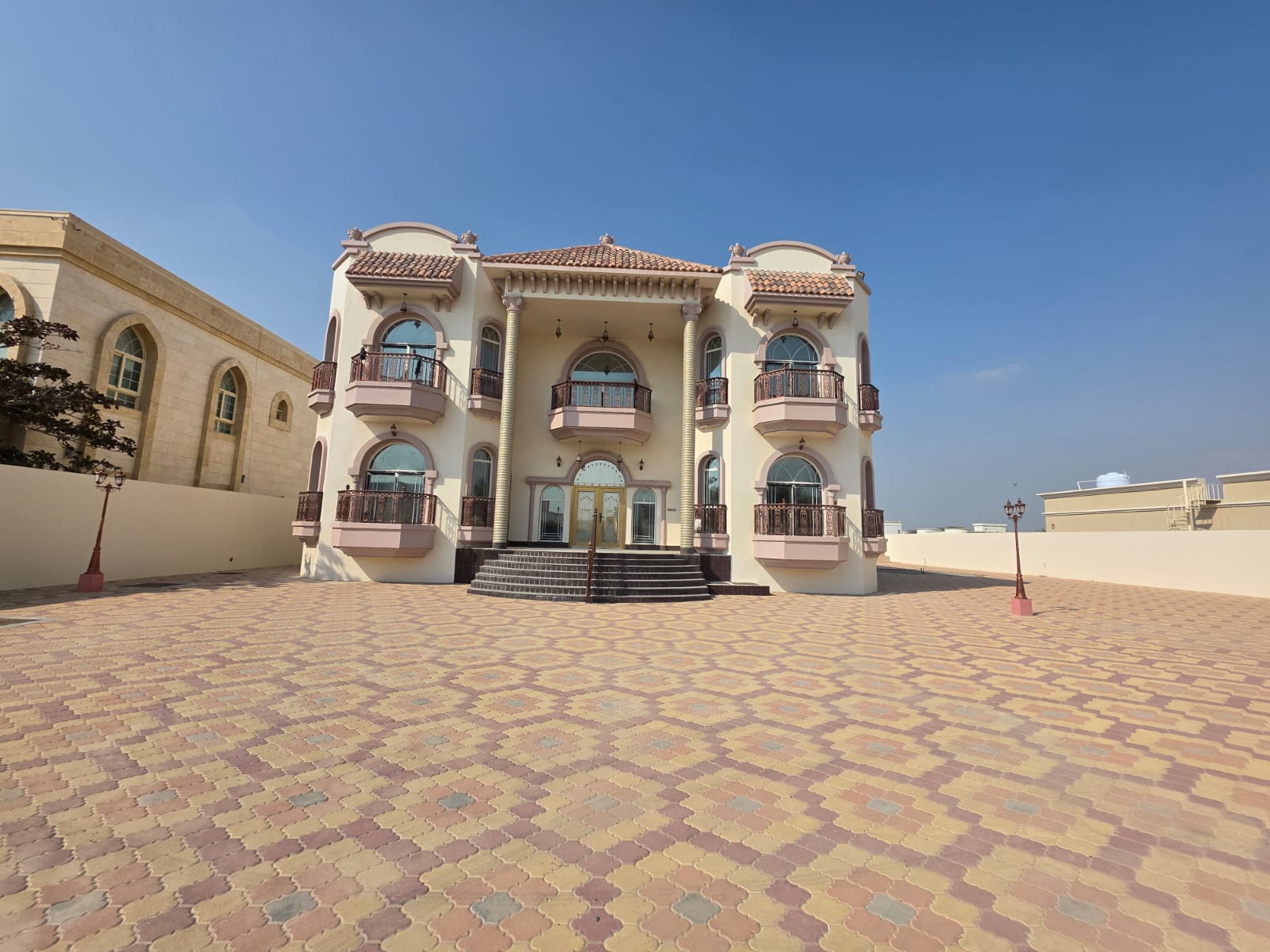 An architectural masterpiece for sale in Al Rahmaniya 4, Sharjah. A super deluxe ground and first floor villa, luxurious modern design and high-end fi