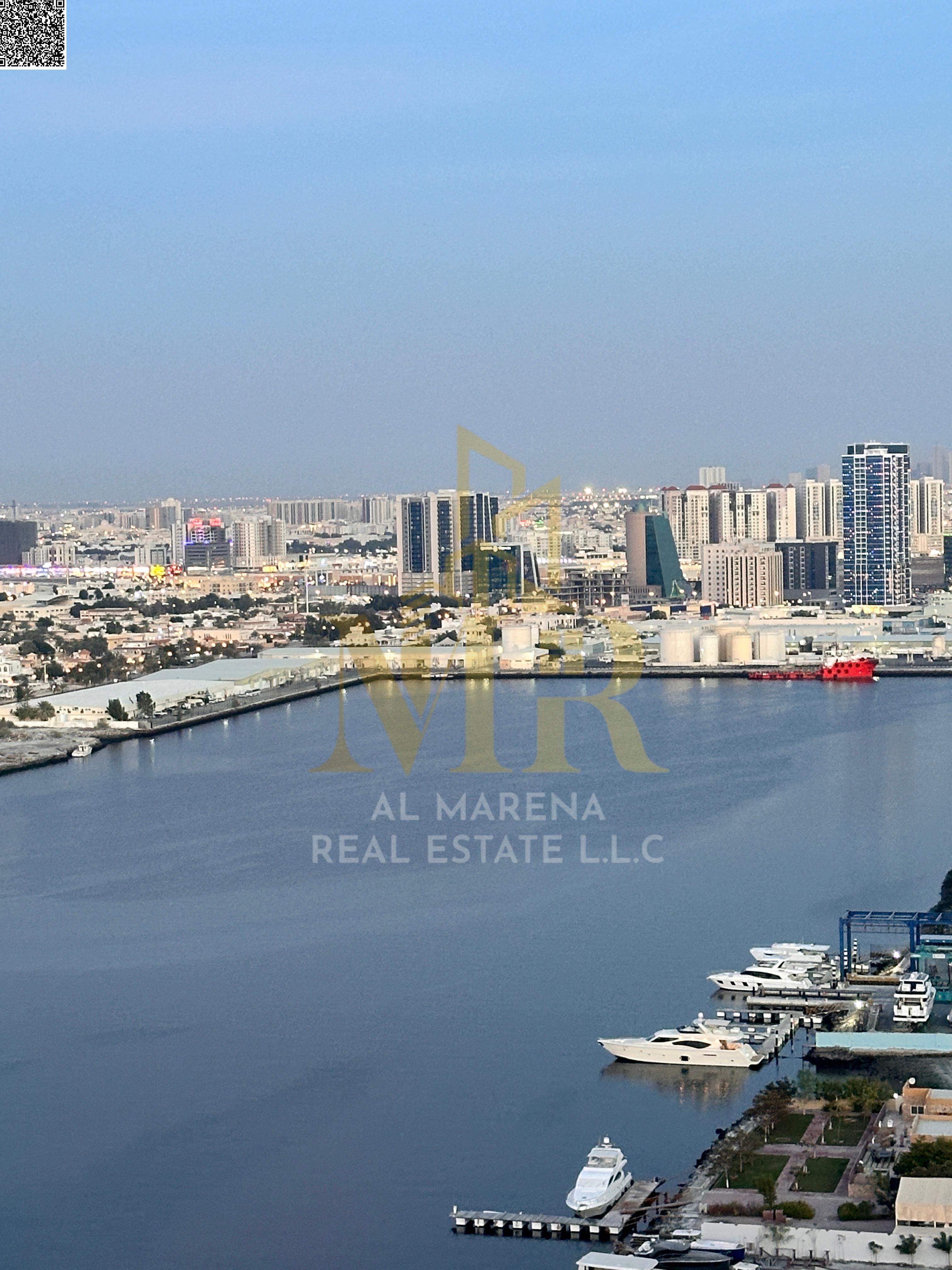 Two-bedroom apartment for sale in Al Waha Towers – prime location in Al Rashidiya 1, modern design, spacious with a beautiful view, and a great invest