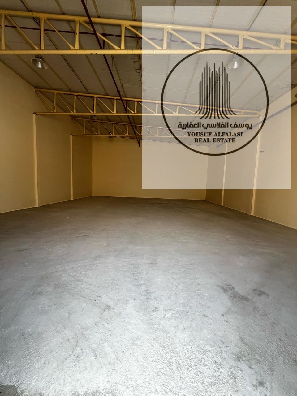 Warehouse for rent in Ajman Industrial 2 area 2,500 sqft height 6.5 m power 20 kW suitable for storage and commercial activities.