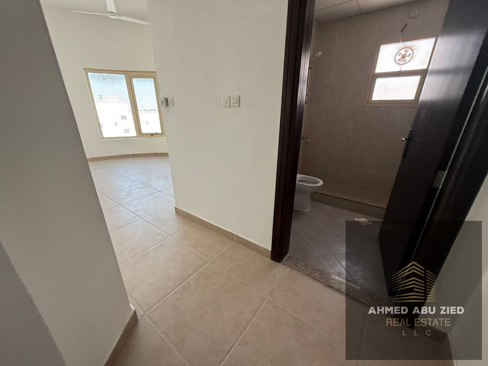 Largest two-bedroom master apartment with a living room in Rawda 2, Ajman, featuring spacious areas, a balcony, and free parking.