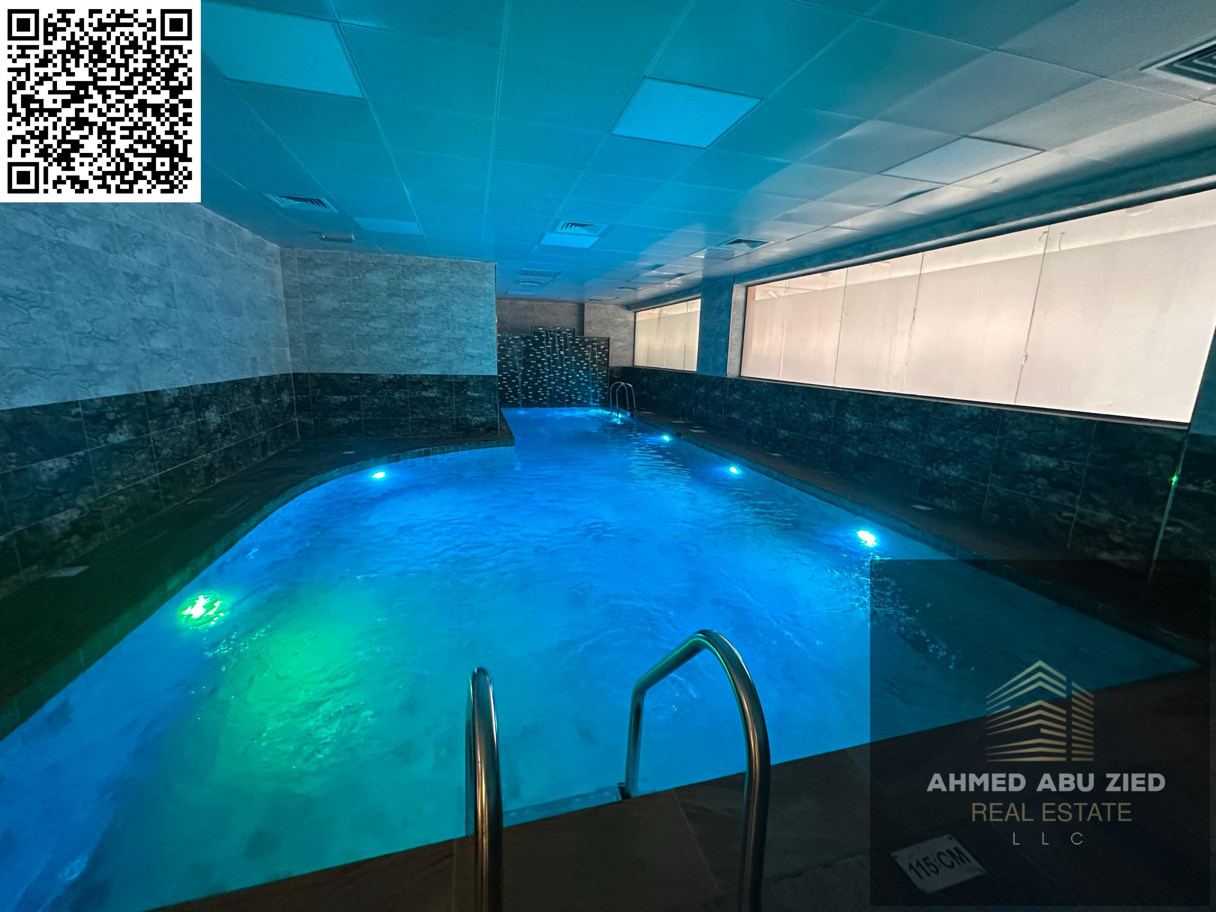 2BR hall apartment for first occupants in Al Muweihat 3, 2 baths, balcony, built-in wardrobes, gym & pool access, AED 50,000, 4 payments, security ch