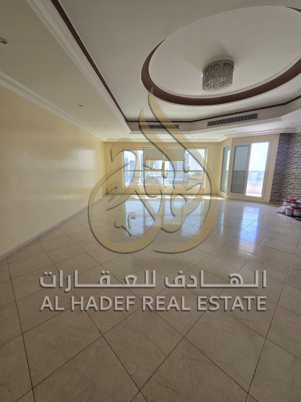 For rent in Al Khan: 3-bedroom apartment with living room, maid's room, sea view, free parking, free gym and swimming pool