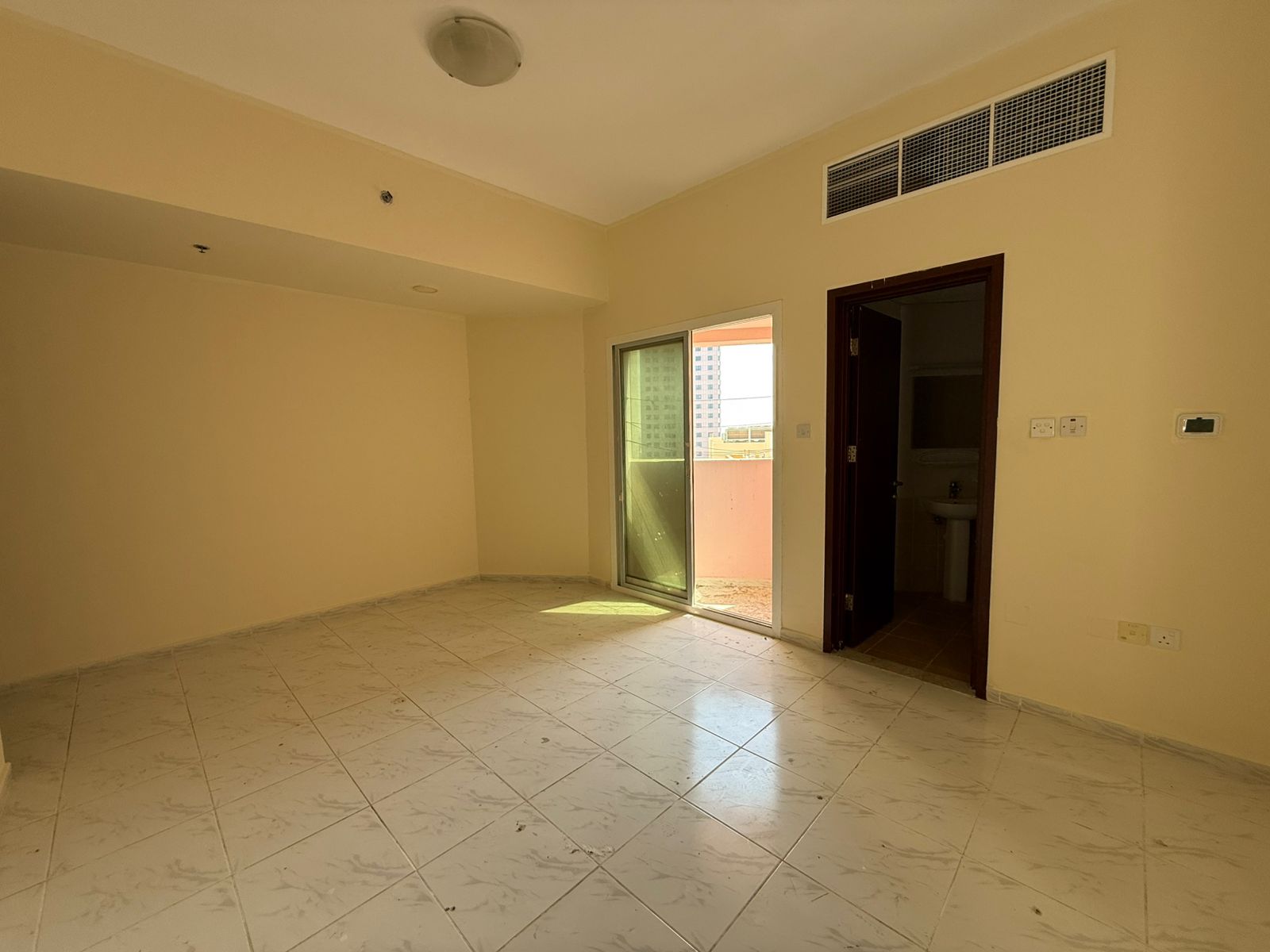 3BR apartment with balcony and open view in the heart of Sharjah, prestigious tower, family-only building.