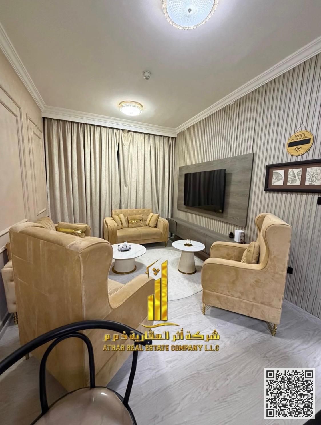 Furnished one-bedroom apartment for monthly rent in Ajman - Khalifa Street, City Towers. Elegant furnishings, open view, includes bills and internet.