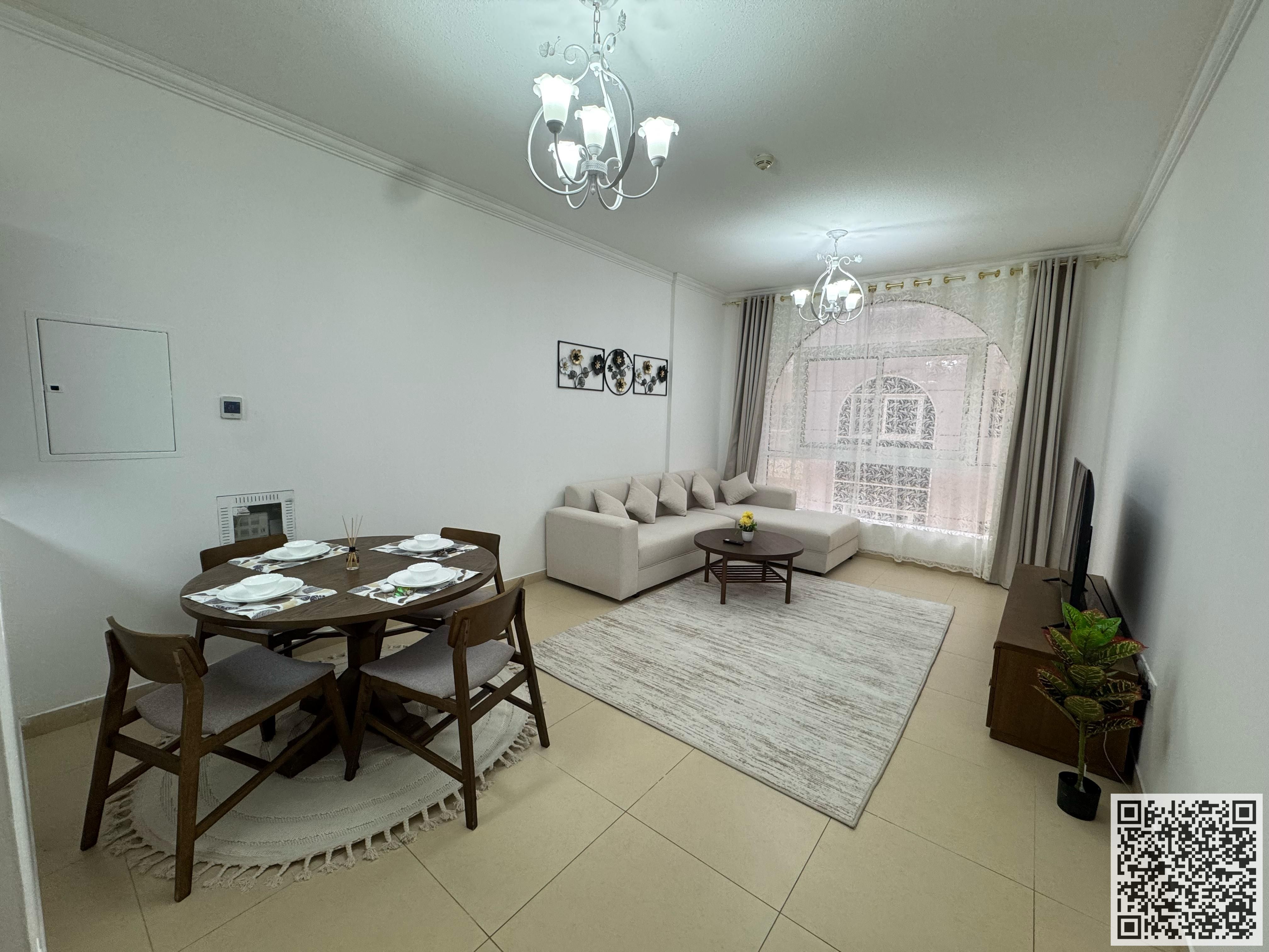 Luxury Apartment One bedroom and living room with a balcony offering an open view, available for monthly rent in Ajman, Al Yasmin Towers