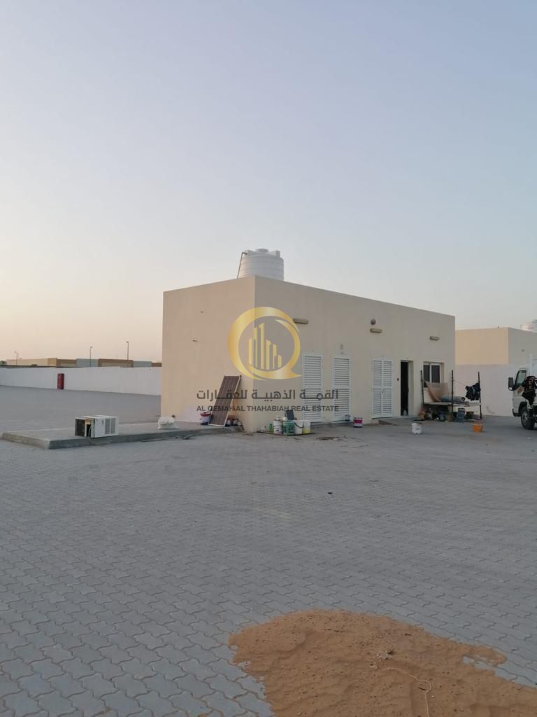 For sale: a plot in the UAE Industrial City in Al-Sajaa on Street 97 Al-Aam. Excellent location next to Al-Qariah Auction.
