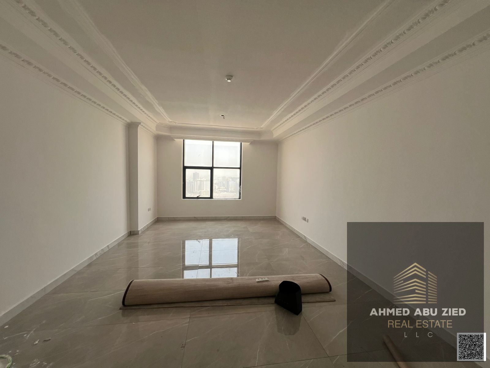 2 master bedrooms + hall for rent in luxury tower Ajman, balcony, central AC, 1 month free, pool, gym, kids area, prime location.