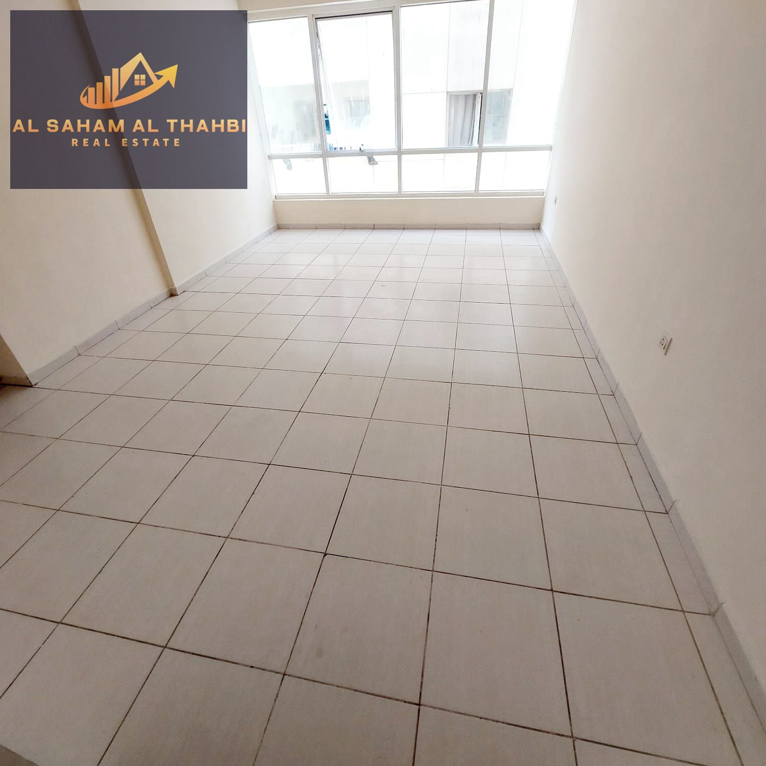 One-bedroom apartment with a balcony and two bathrooms for rent in Al Taawun
