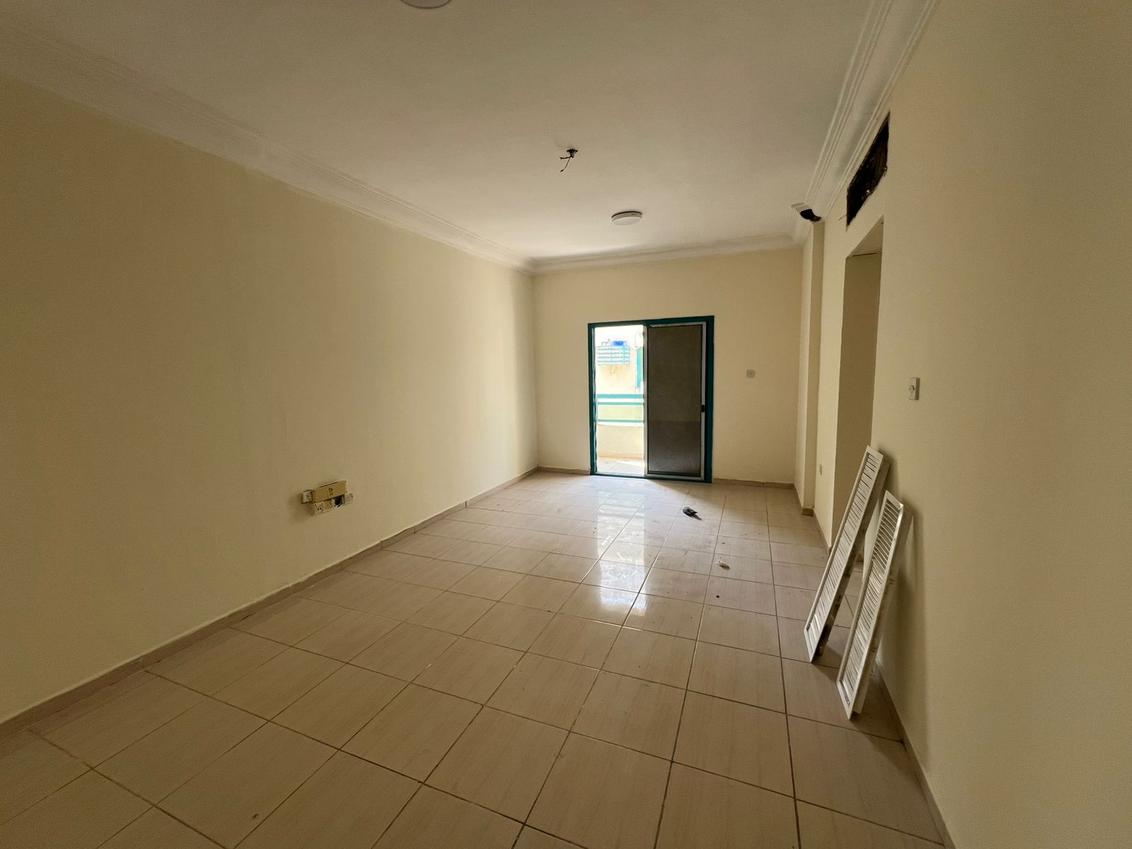 The most beautiful 2-bedroom apartment with a large living room and a spacious balcony, with central air conditioning in Al Qasimia, Al Nad