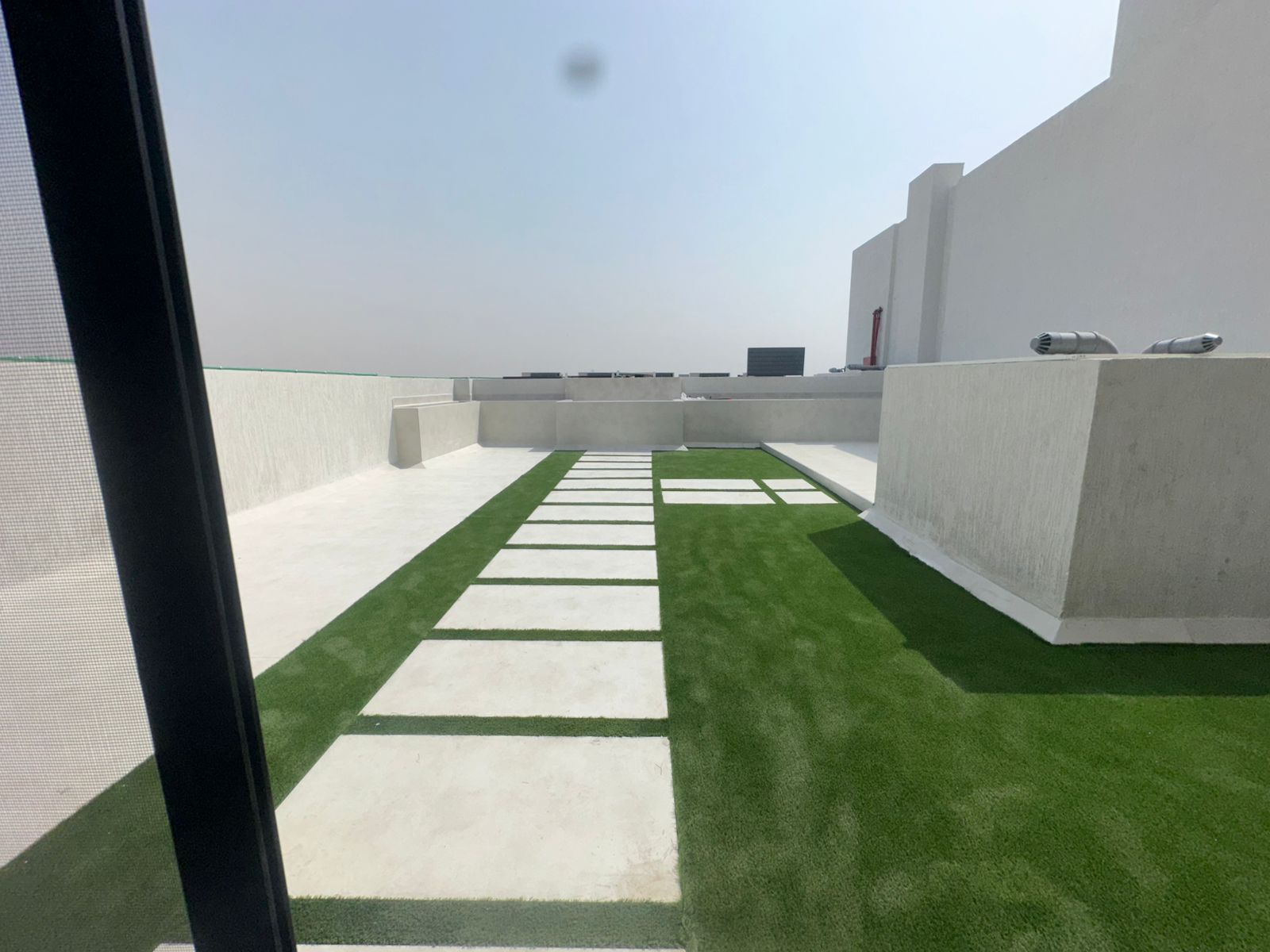 3 bedrooms and a living room with a large roof, first resident, area exceeding 2000 sq ft, includes a maid's room, excellent location close to Sheikh