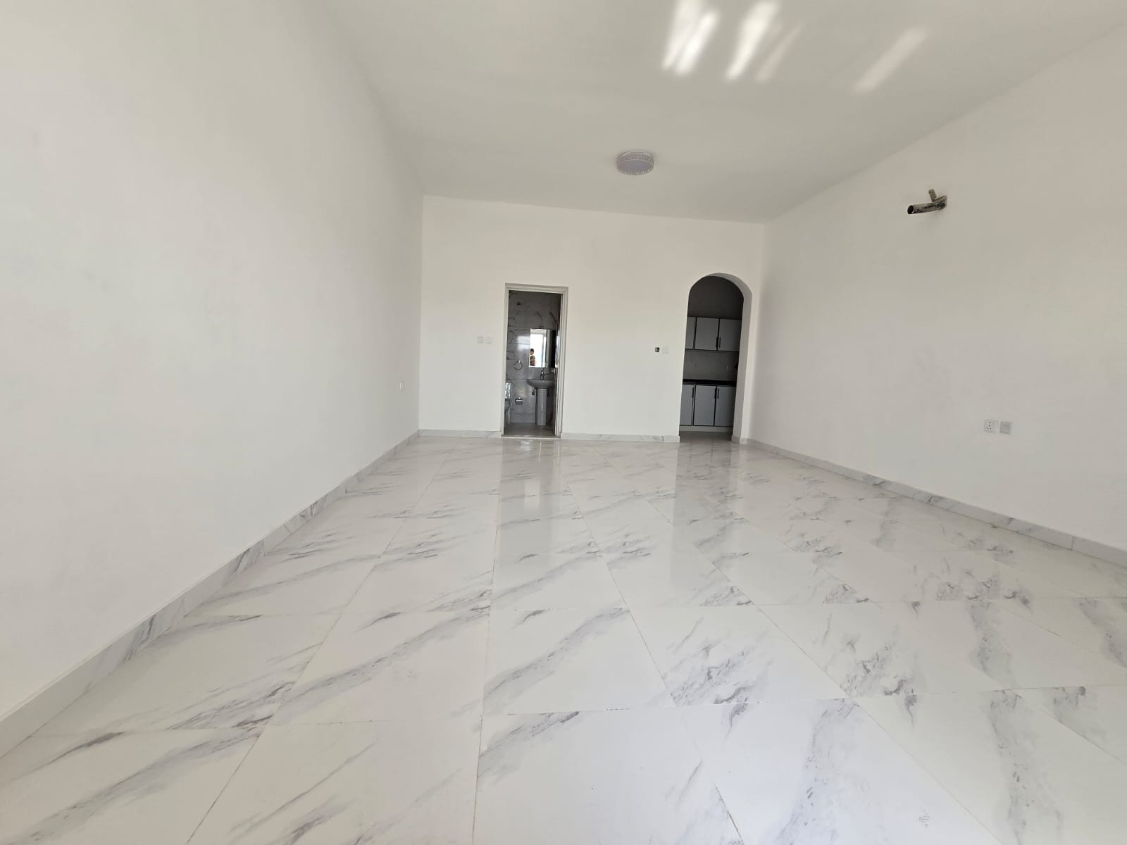 Brand new studio for annual rent in Al Jurf 2, first tenant, located behind China Mall and close