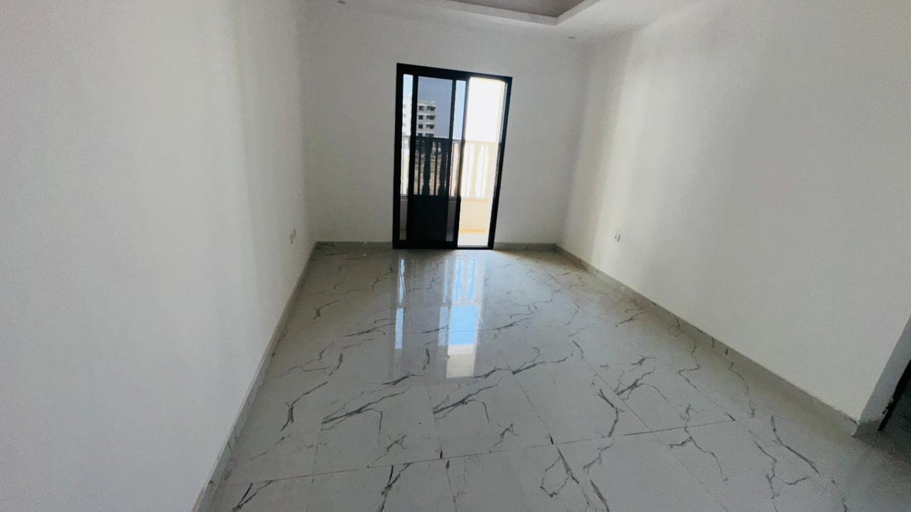 Two bedrooms and a living room for annual rent in Al Alia, first occupancy, behind Bait Al Mutwahid. Spacious area, prime location with a view,