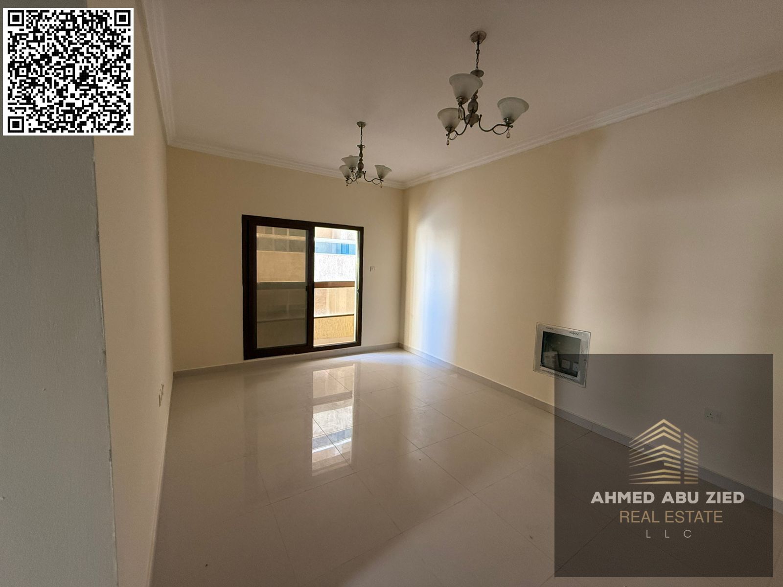 A one-bedroom apartment with a living room, two bathrooms, and a balcony with an open view, featuring built-in wardrobes and central air conditioning,