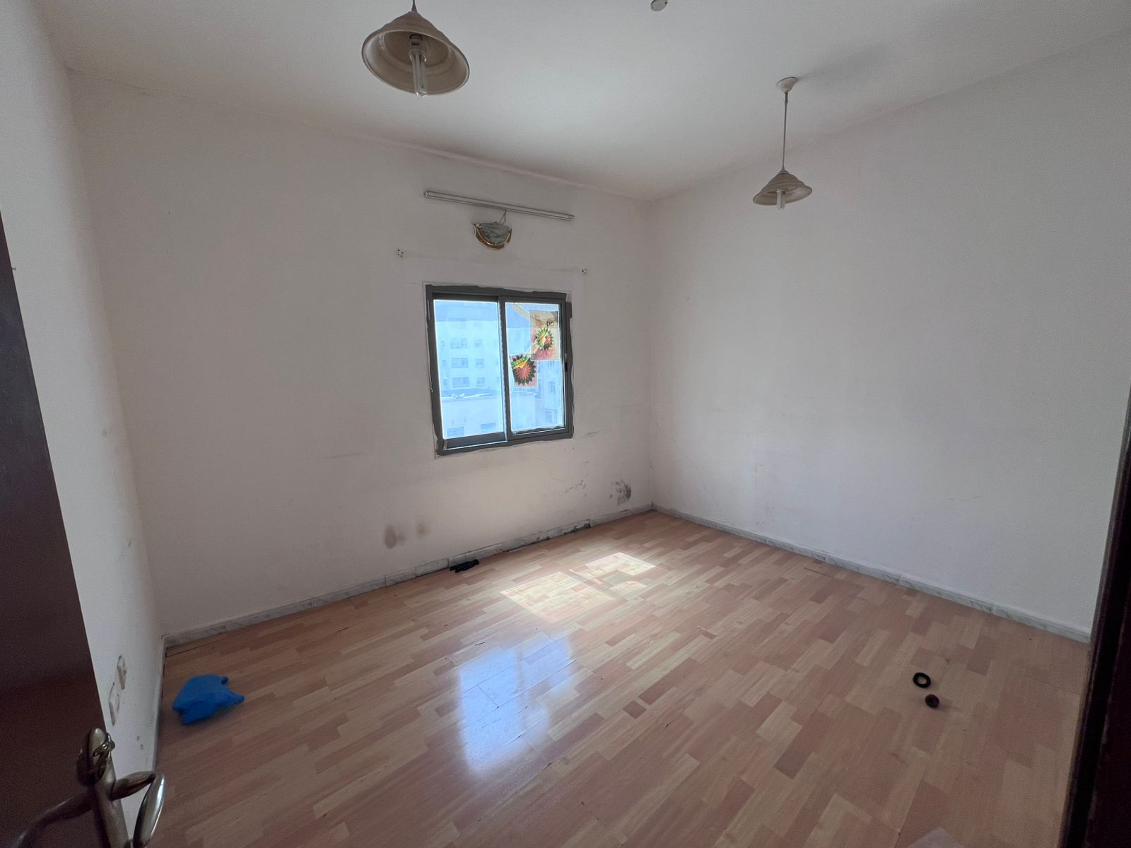 One-bedroom apartment with living room for annual rent in Ajman Corniche, second row from the Corniche, 23K AED on 4 payments, balcony with excellent