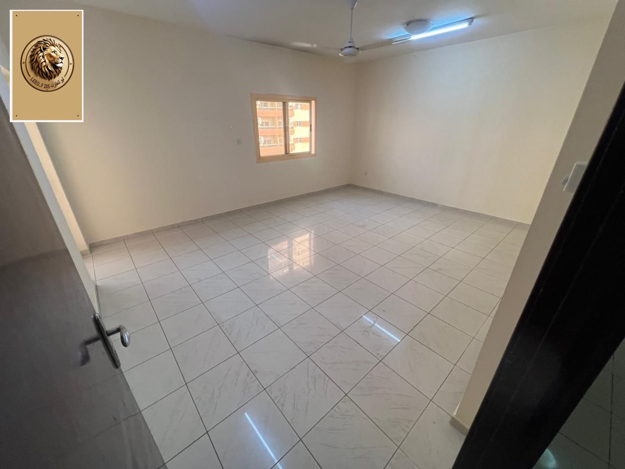 For annual rent in Ajman - Al Nuaimiya 2 A very spacious two-bedroom apartment with a living room in a prime location close to all amenities