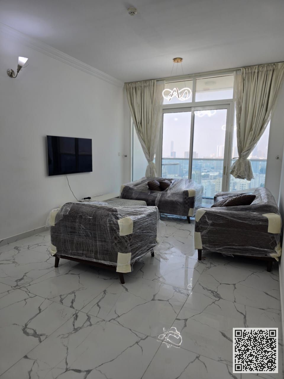 With an open view, a furnished 2 -bedroom apartment with a living room for monthly rent in Ajman - Al Rashidiya Includes bills , Gym, pool, parking