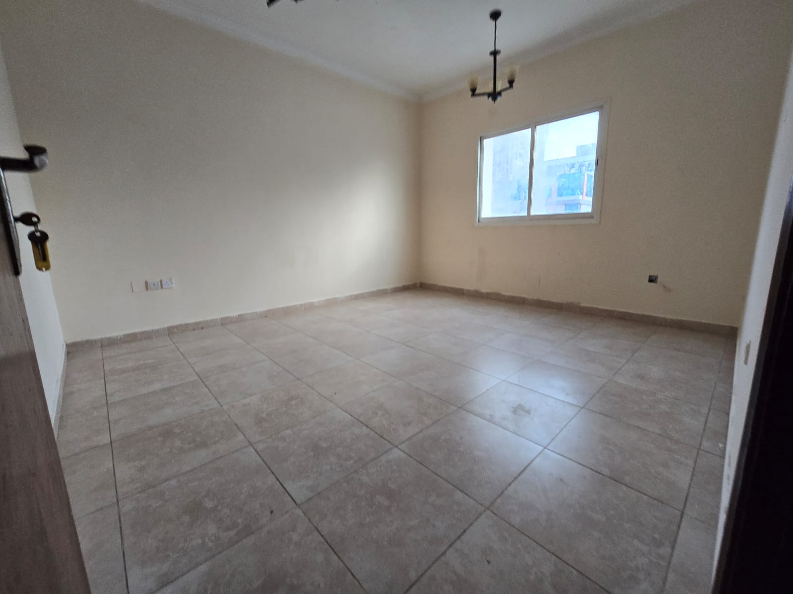 For annual rent in Al Jurf 2 - Ajman, a two-bedroom apartment with a living room, two bathrooms, a large area and open view, excellent finishing, 34,0