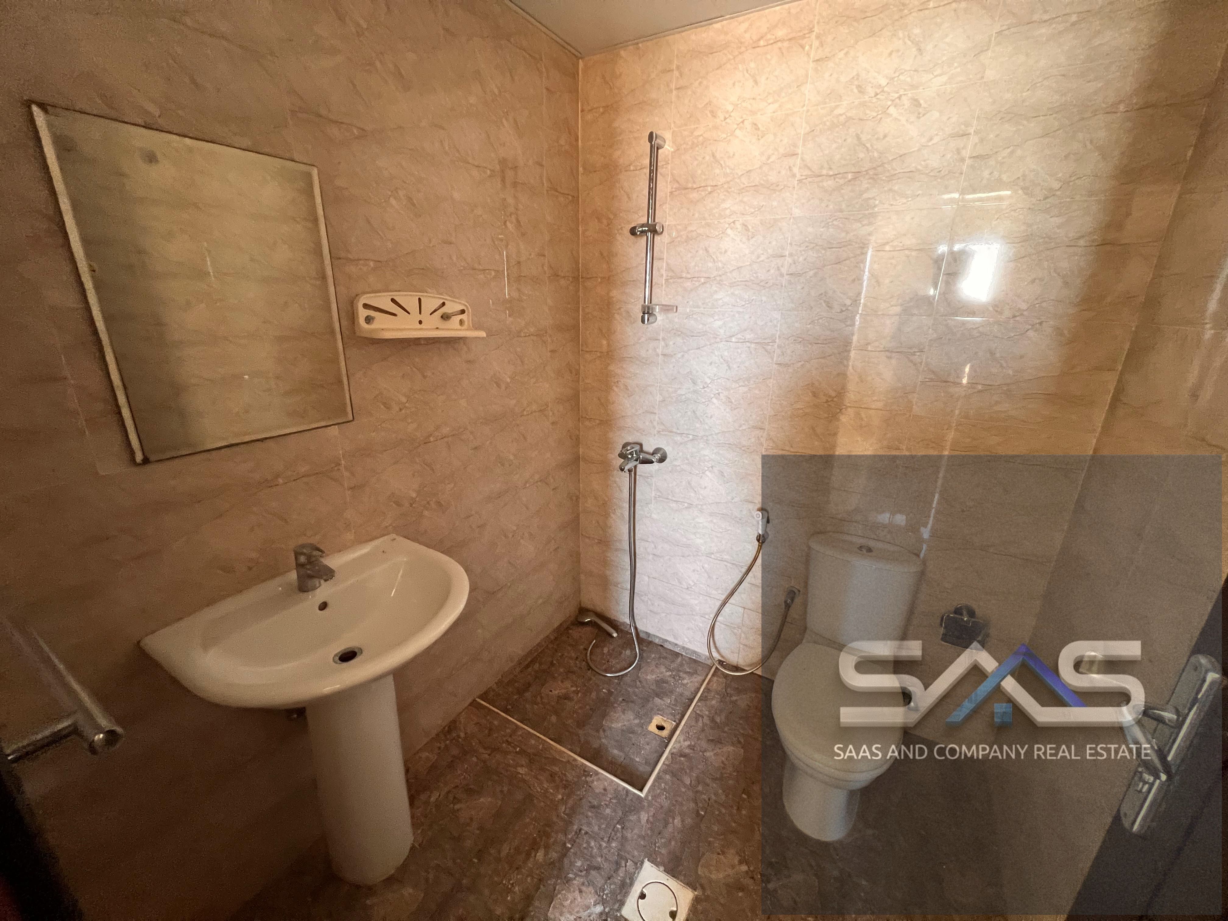 Studio apartment with a semi-detached kitchen, central air conditioning, spacious areas, and a prime location in Al Nuaimiya 3.