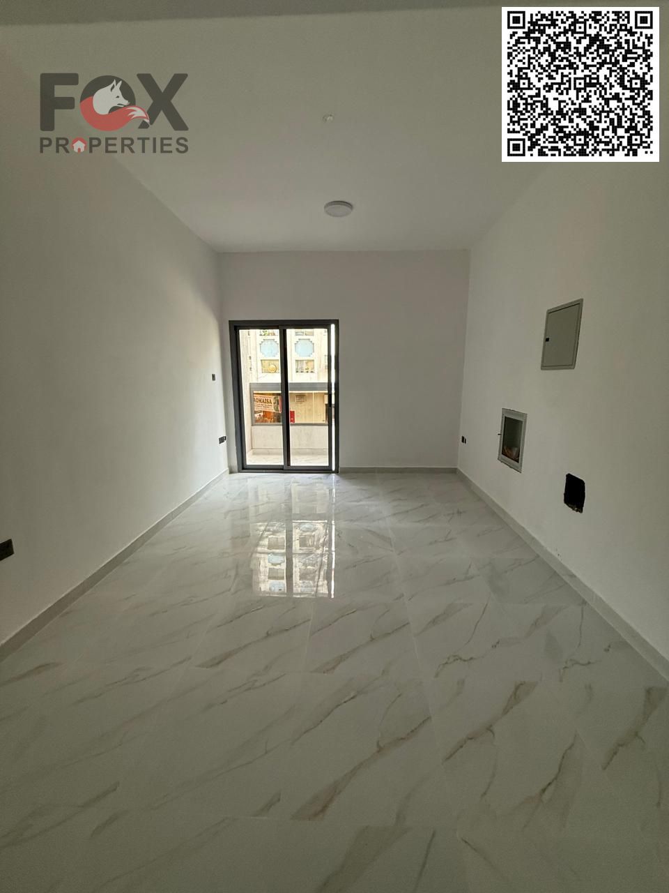 1BHK for yearly rent in Al Karama near Ajman Corniche. Master bedroom, 2 baths, balcony, central AC. AED 33K in 4 payments, deposit 3000 cheque.