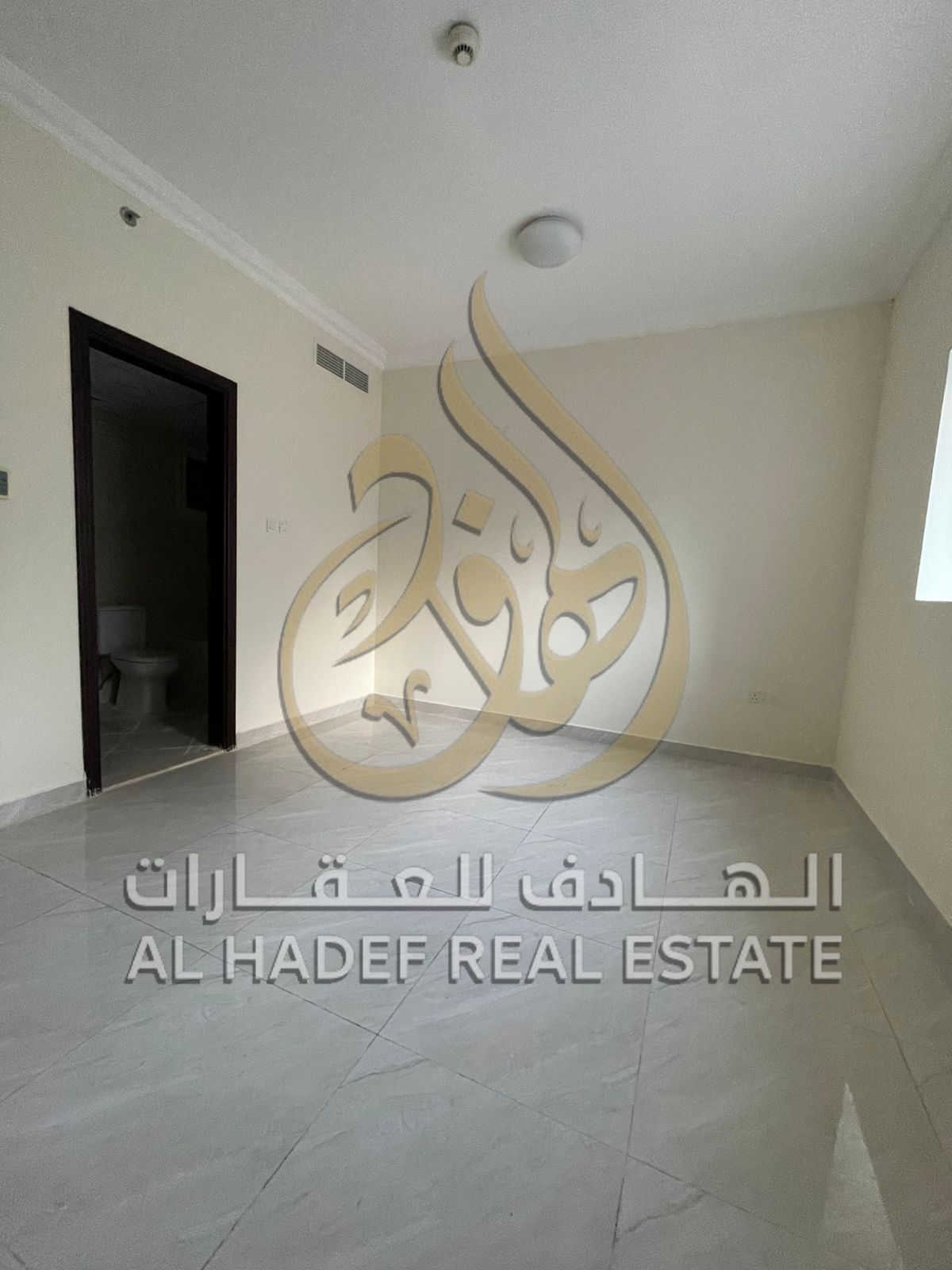 Two-bedroom apartment with a living room for rent in Al Majaz 2, featuring spacious areas, a balcony with a distinctive view, and free parking.