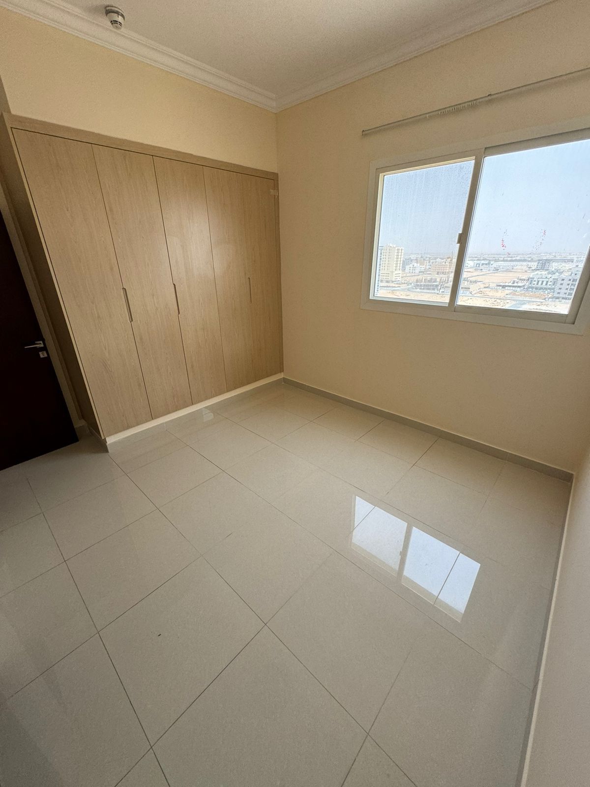 For rent in Al Jurf 3, Ajman: 1BR + hall, 2 bathrooms, built-in wardrobes, luxury finishing, first tenant, prime location near services.