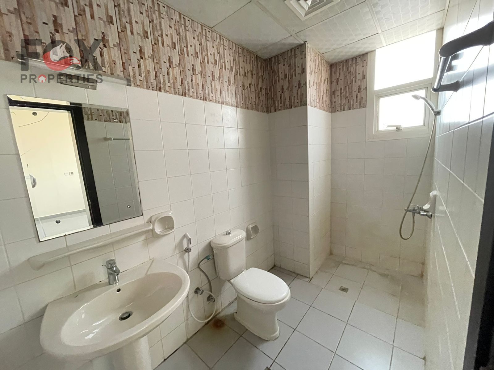 Studio for annual rent in Al-Aliyah, second tenant in a very clean building, strategically located directly on Mohammed Bin Zayed Street