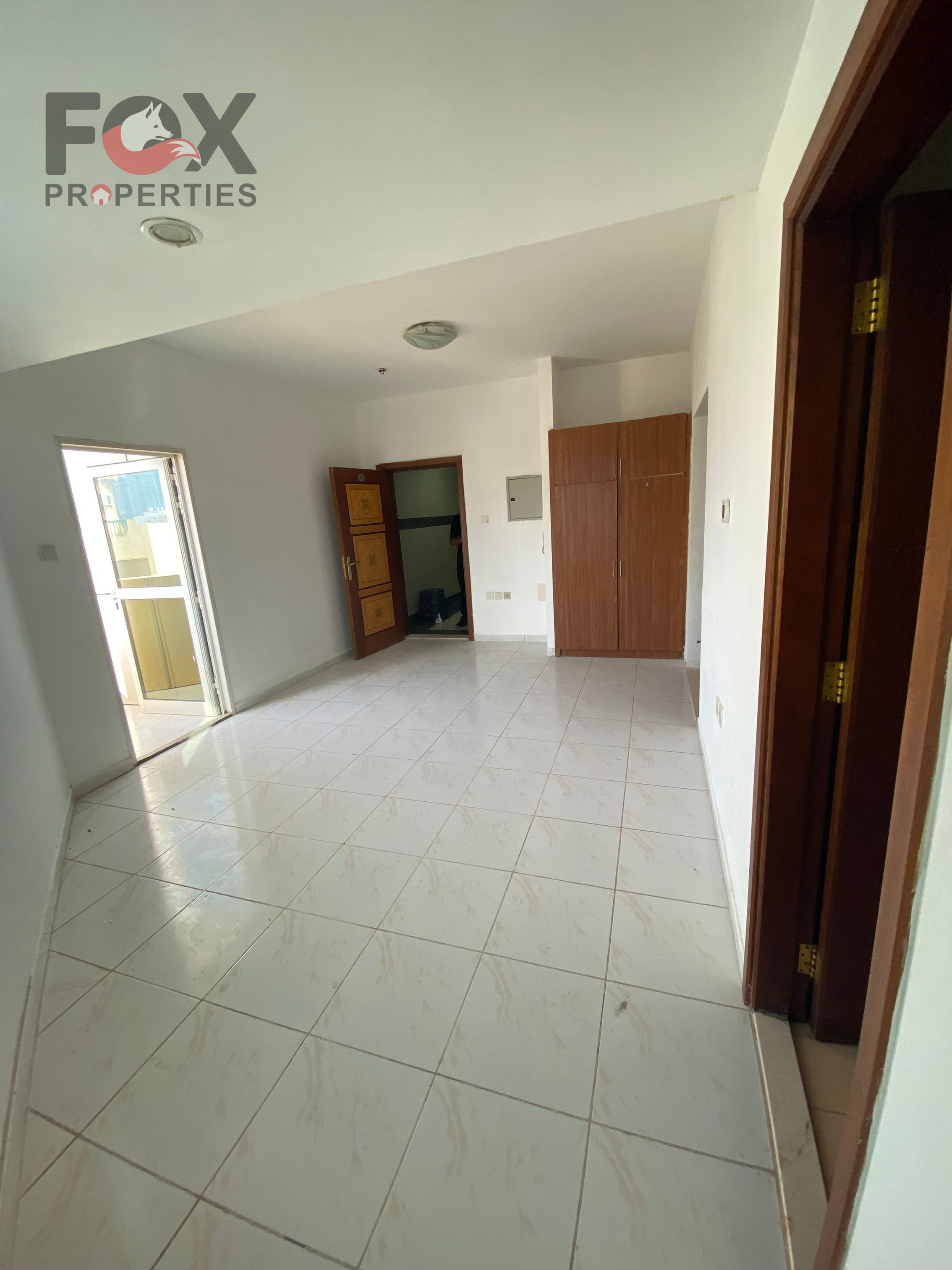 Studio for rent in Al Rashidiya 3, Ajman. The studio features a separate kitchen and a practical layout with a comfortable living space suitable for individuals.