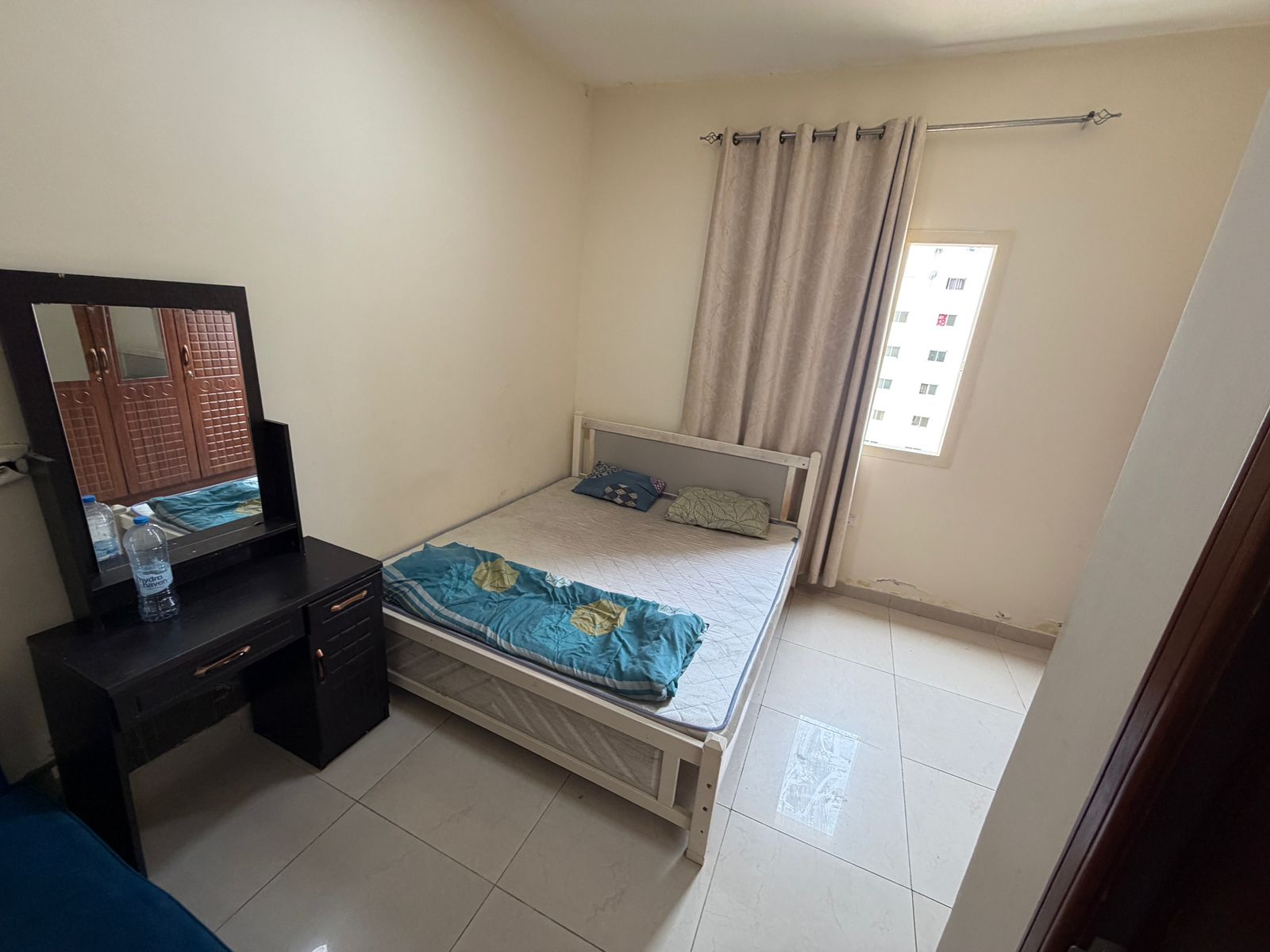 Furnished 1BR in Al Rashidiya, Ajman. 2 baths, central AC, bright & spacious, bills & internet included, 3,200 AED/month.